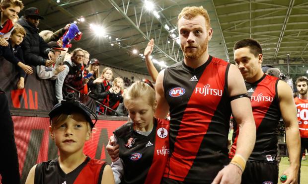 AFL 2016 Rd 22 - Essendon v Western Bulldogs MELBOURNE, AUSTRALIA - AUGUST 21: Adam Cooney of the Bombers (left) walks off after his 250th and final game with Mathew Stokes of the Bombers after his 200th and final game during the 2016 AFL Round 22 match between the Essendon Bombers and the Western Bulldogs at Etihad Stadium on August 21, 2016 in Melbourne, Australia. (Photo by Adam Trafford/AFL Media)